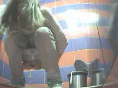 Hot blonde exposed to spy cam in public loo