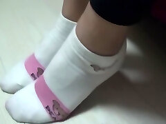 Chinese footjob with socks on pants