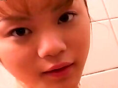 Super-cute petite Japanese girlie takes shower flashing her nice ass and bra-stuffers