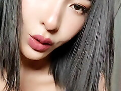 Famous Chinese actress Elise in blue stocking lingerie. DD natural milky chinese tits.