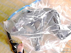 Super-cute Latex girl on vacuum bag and mask, breathplay