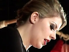 Extraordinaire blonde dominatrix spanking her thrall