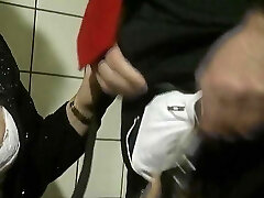 An older German lady gets her mouth covered in the bathroom
