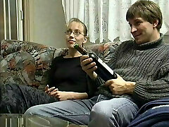 Young Couple in the 90s pummeled on the Couch