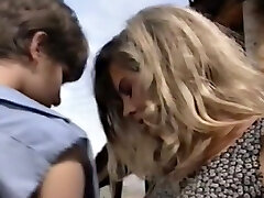 Gorgeous blonde milf with sunglasses feels horny for a young country chick