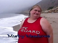 Fat lifeguard tramps gobble food on the beach