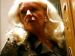 Old and busty German granny in stockings enjoys making a cock spunk