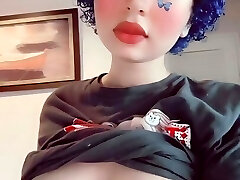 Depressed butterfly goth girl plays with her boobs
