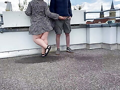 Gorgeous pissing mother-in-law helps son-in-law-in-law pee on the top of the parking lot
