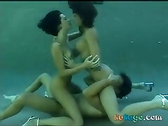 Underwater sex with two scorching brunettes