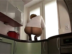 This cockslut likes to demonstrate off her nylon covered ass on top of the kitchen counter