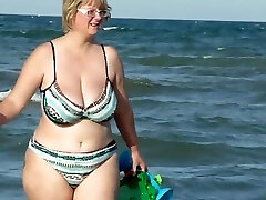 chubby mom stagged on the beach