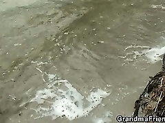 Old bitch takes 2 cocks outdoors