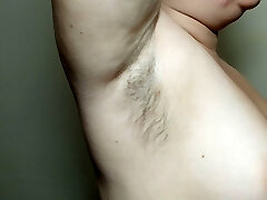 Ellie displays her hairy armpits and plays with them