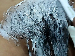 Cindy shaving her unshaved pussy.