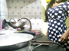 Indian bhabhi cooking in kitchen and boning brother-in-law