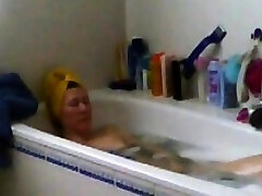 mom masturbates in tub