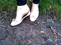 Crossdresser Monica kick cig under flats