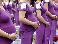Pregnant Asian femmes doing yoga (non porn)