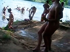 Hidden cam movie taken while strolling through a nudist beach