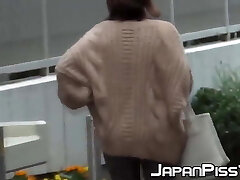 Naughty Japanese bombshells pissing in the streets