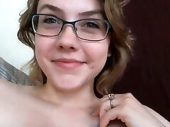 Redhead slut plays with her nipples