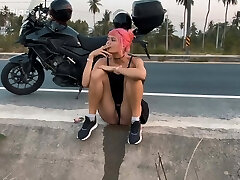 Motorcycle girlfriend peeing on the roadside