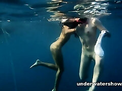 Nastya and Masha are swimming bare in the sea Nastya and Masha are swimming bare in the sea