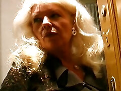 Elderly and big-chested German granny in stockings enjoys making a cock cum