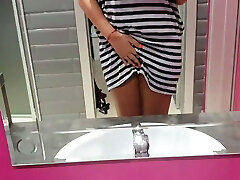 Horny nubile in public toilet – so naughty she opens her pussy