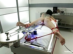 Booty siren gets restrain bondage and drilled by a machine