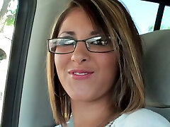 Seductive blonde chick wearing glasses leads dirty talks in the truck