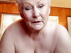 Nasty Granny Showing Off Her Immense Puss As She Rubs It With A Dildo