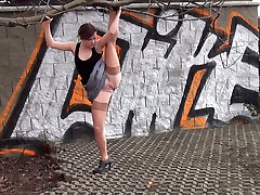 Rather flexible amateur black head pulls up one gam and urinates outdoors