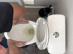 High on pot and fit to bust standing on public rest room desperate to urinate open wide gulp up piss slut