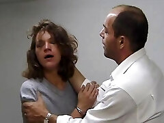 Policeman searches with his forearm in her vagina