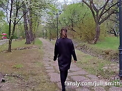 Hot gal in a highly short dress walks in the park and flashes her pussy