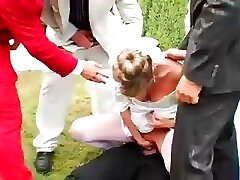 Bride gets ravaged by groom’s buddies and showered with cum