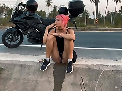 Motorbike girlfriend peeing on the roadside Motorbike girlfriend peeing on the roadside