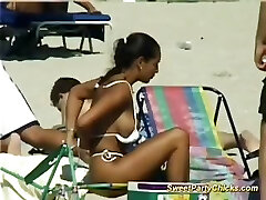 Sweet soiree chicks flashing their big tits on the beach