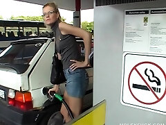 Slut at the gas station shower has gloryhole sex