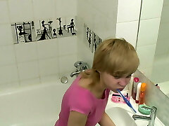 Teen female's morning hygiene in the bathroom