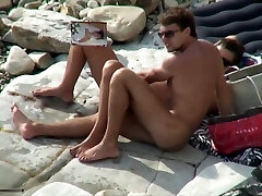 Breasty tart sucking cock on a beach