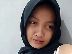 A hot biotch in a hijab records a sex movie for her boyfriend where she masturbates