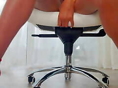 sitting on a chair in my maxine holloway medical and masturbating
