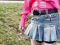 sissy walks around in denim mini skirt and shows her ass and penis in her chastity cage