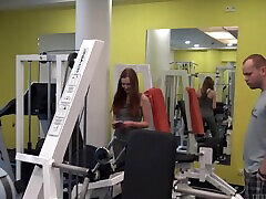 Kinky redhead Linda Sweet spreads legs to have sex in samal anal gym