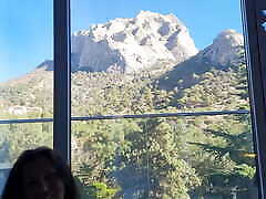 old men xxx ung girl in a hotel with a beautiful view of the mountains