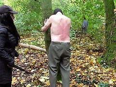Spank session in the forest, male slave by Femdom Austria