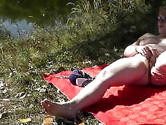 MILF solo. Wild beach. hard ass fucck story nudity. Sexy MILF on river bank fingers wet pussy and has strong orgasm. Naked in public. Outdoors